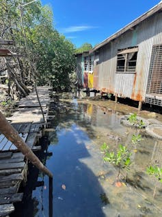 A body of water alongside homes.