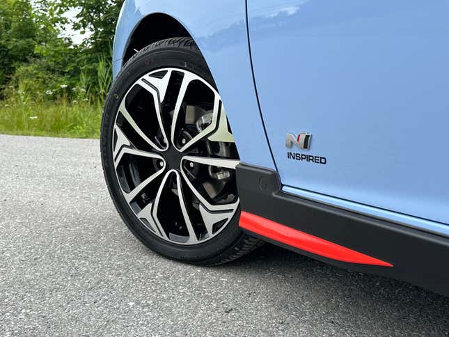 a close-up of the front wheel and N inspired badge