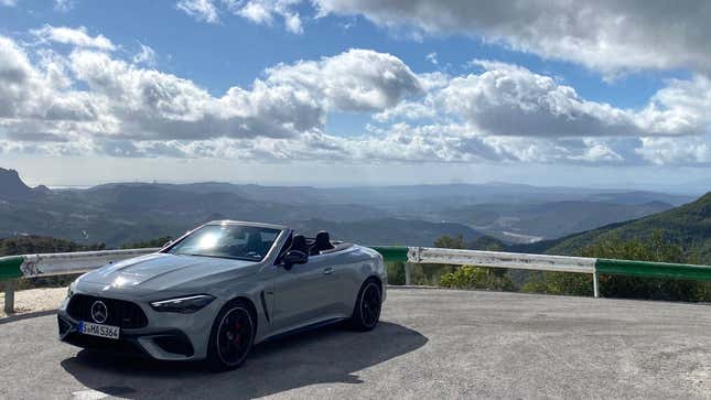 a gray CLE parked in front of a beautiful view