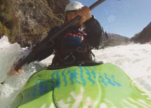 Navigating the whitewater rapids in a kayak